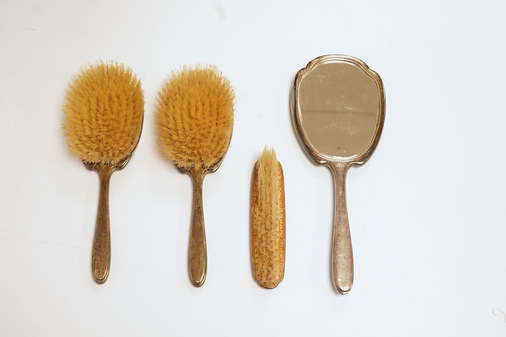 A George V silver and blue guilloche enamel four piece mirror and brush set, Adie Bros. Birmingham, 1935, mirror 28.8cm. Condition - poor